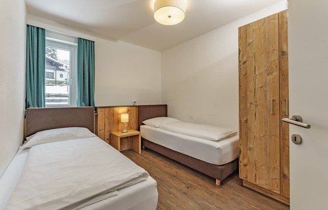 Sleeping room with two single beds